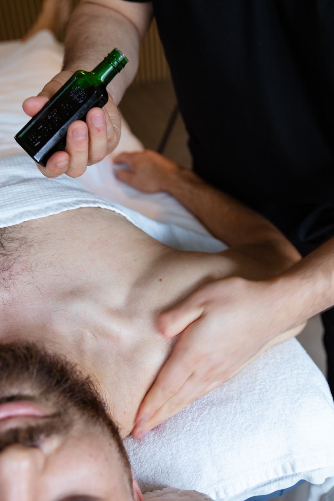 Massage at the base of the neck for tension headaches